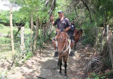 Beach horse back riding with countryside